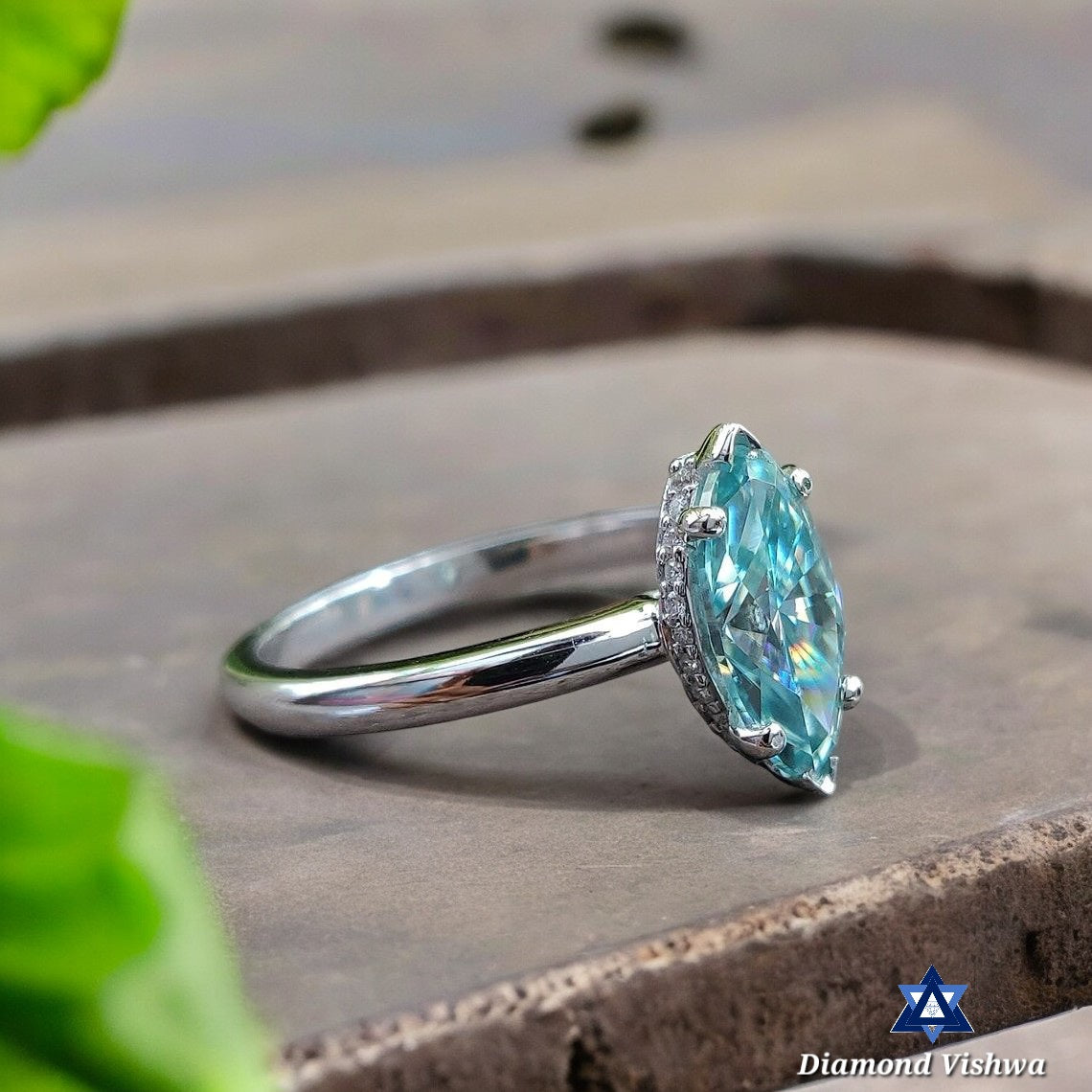 Center Stone Details: - Shape: Marquise Cut - Size: 1.16 CT - Color: Cyan Blue  - Clarity: VVS1 - Measurement: 10 * 5 MM - Luster: Excellent - Make: High Quality