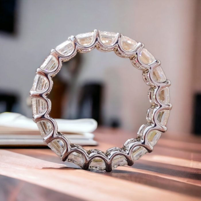 Emerald Cut Moissanite Eternity Ring with Unique Trellis Prong Setting - Image 2