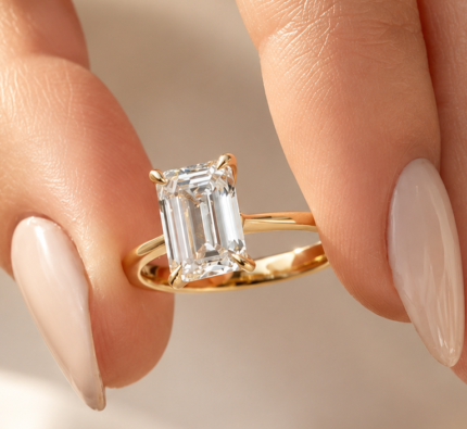 2.5 ct emerald cut lab-grown diamond solitaire in 14K yellow gold, angled view
