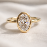 1.5 CT Oval Lab-Grown Diamond Bezel Engagement Ring in 14K Yellow Gold