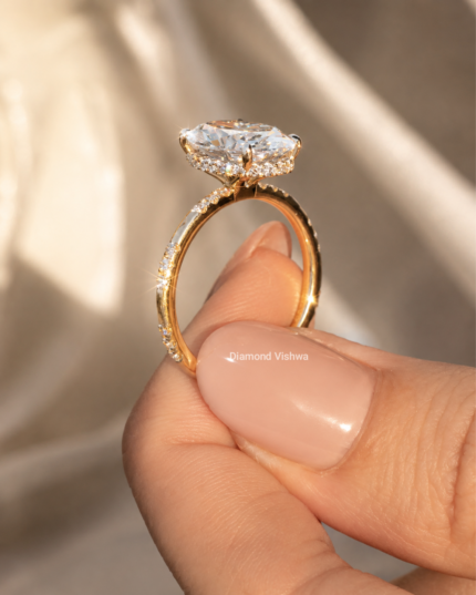 Side profile of an oval lab grown diamond ring showing the hidden halo and elevated four-prong setting