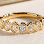 2 TCW Oval Lab Grown Diamond Bezel Wedding Band in 14K Yellow Gold