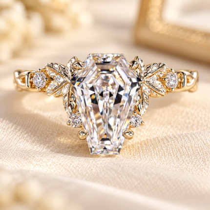 Coffin cut diamond ring with twisted nature-inspired band and round accents, front view on cream fabric