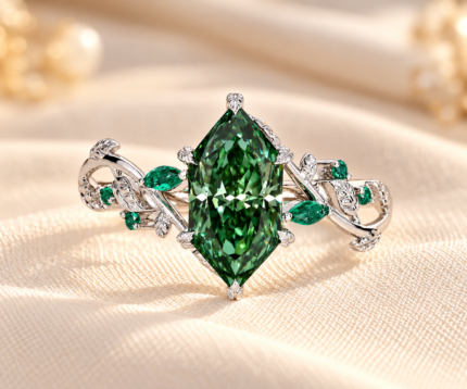 Green Dutch marquise ring with green center diamond and leaf inspired emerald accents, front view