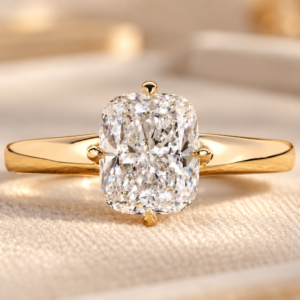 Cushion compass prong ring with a lab grown diamond and polished yellow gold tone band, front view