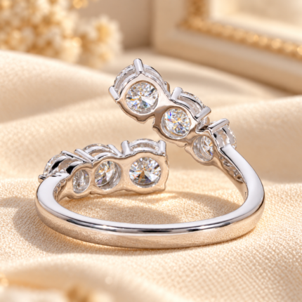 Angled side view of the round diamond bypass ring showing the open wrap band and raised diamond ends