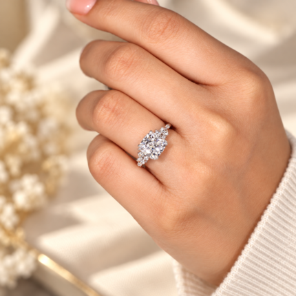 Cushion moissanite hidden halo engagement ring, angled view worn on a finger