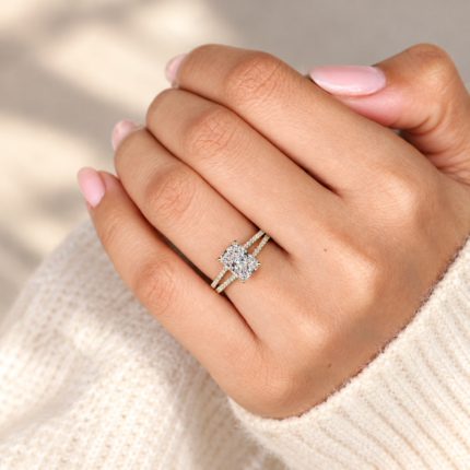 Angled on-hand close-up of radiant lab diamond pavé split shank ring