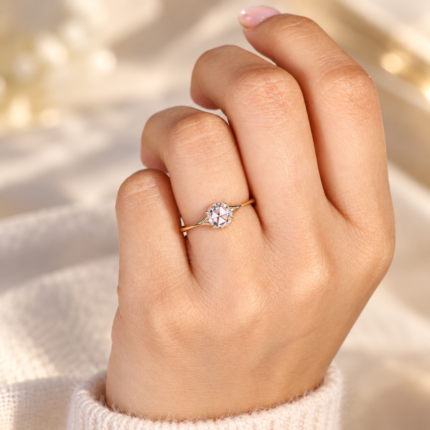 Round rose cut diamond ring worn on curled fingers