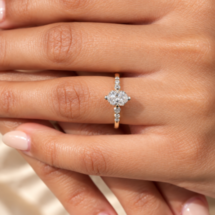 Dutch marquise lab diamond ring worn beside a neutral manicure
