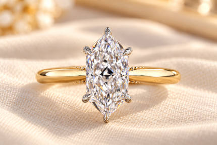 Dutch marquise tulip ring with an elongated lab grown center diamond and polished gold tone band, front view