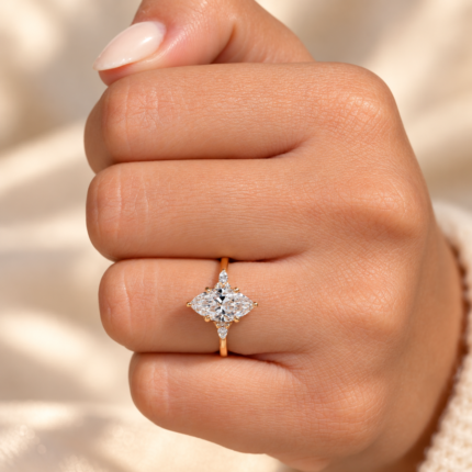 Marquise seven stone diamond ring on a closed hand