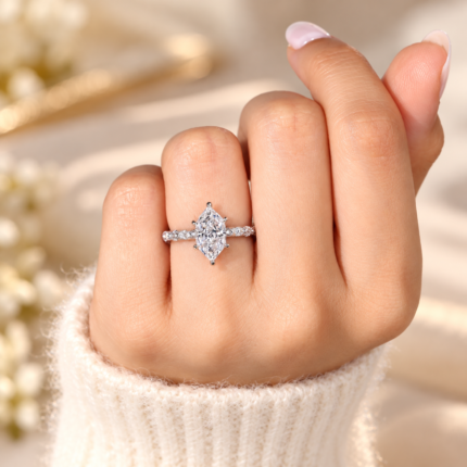 Marquise-shaped diamond ring worn on a hand