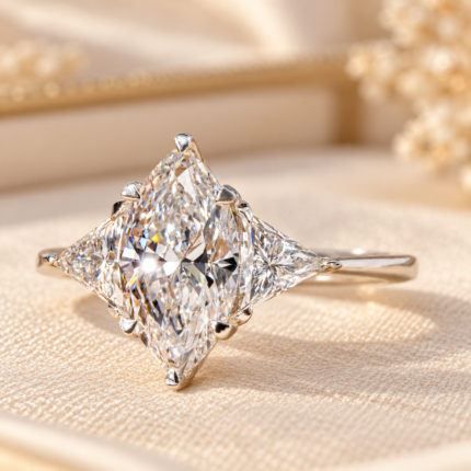 Angled studio view of marquise and trillion three stone diamond ring