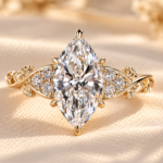Marquise Muse engagement ring with a lab grown center diamond, round accents and gold tone botanical band, front view