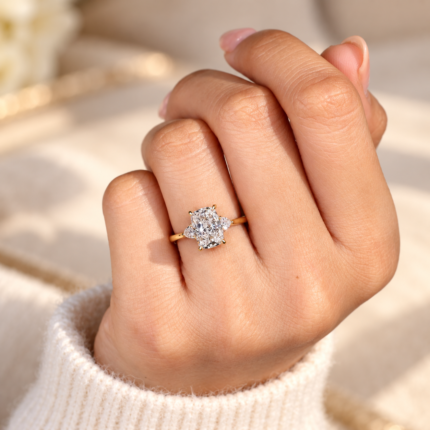 Cushion and trillion diamond ring worn on a hand