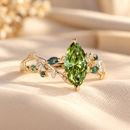Angled front view of the green marquise moss agate ring, showing its green center and leaf shaped accents