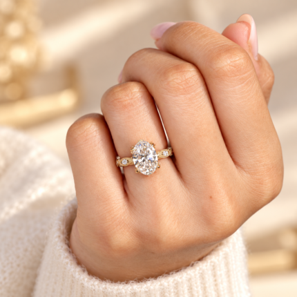 Vintage oval engagement ring worn on a hand
